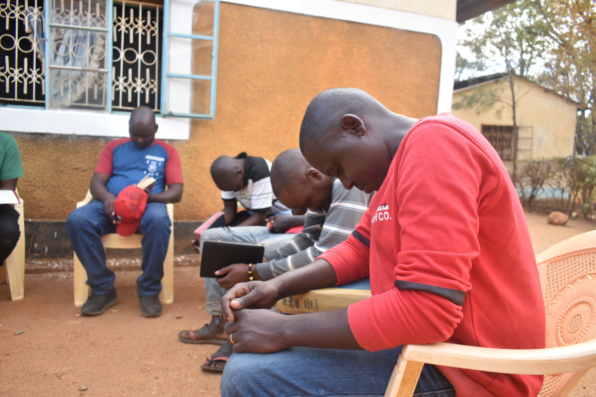 Group taking part in Bible study and prayer