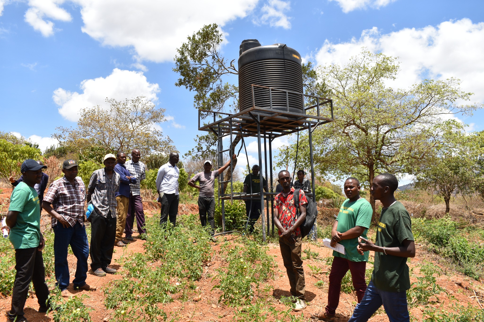 Visitors viewing the farm water storage system