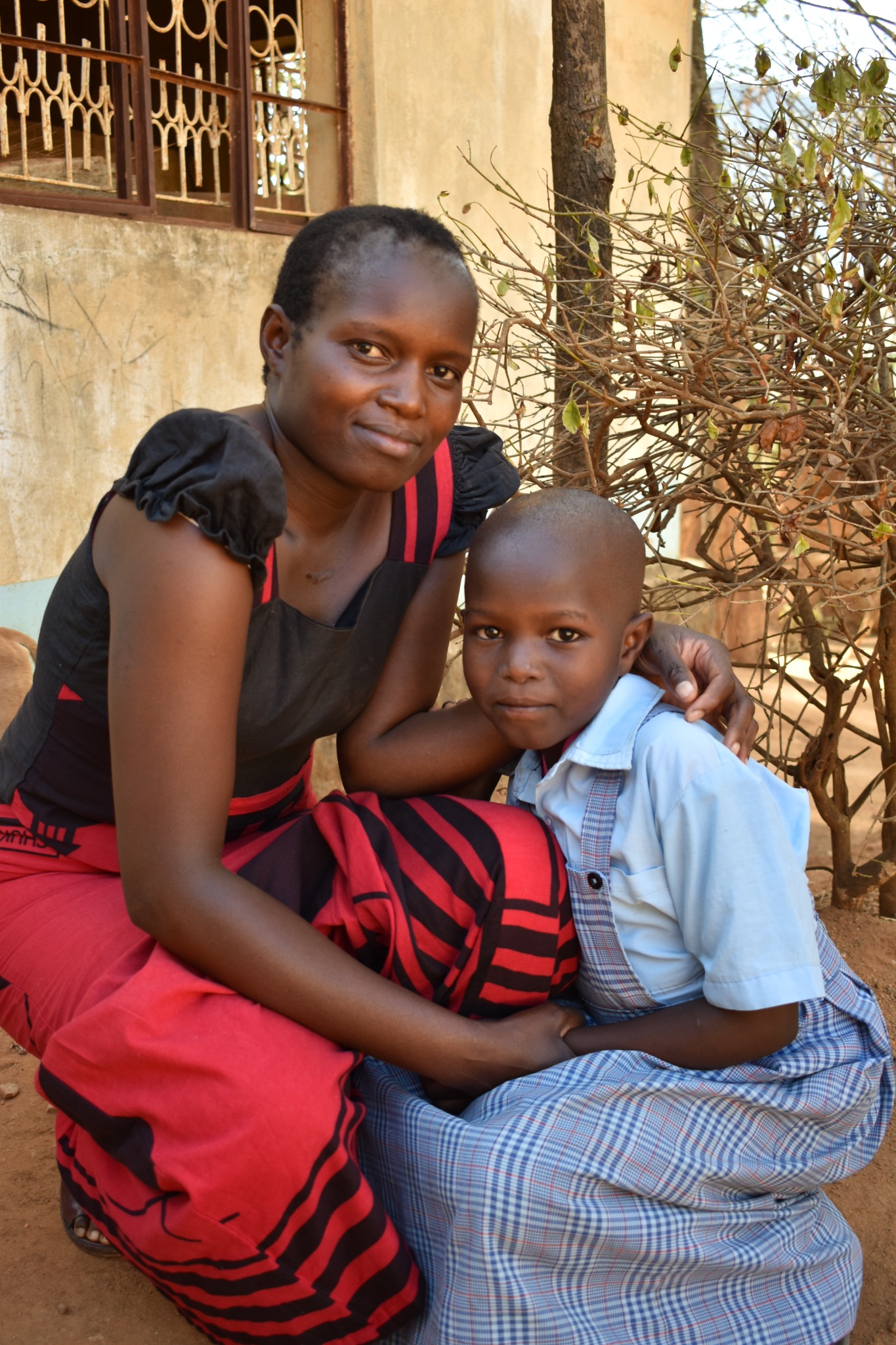 Woman and child seated outdoors